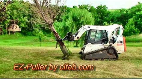 moving trees with a skid steer tips|skid loader for tree puller.